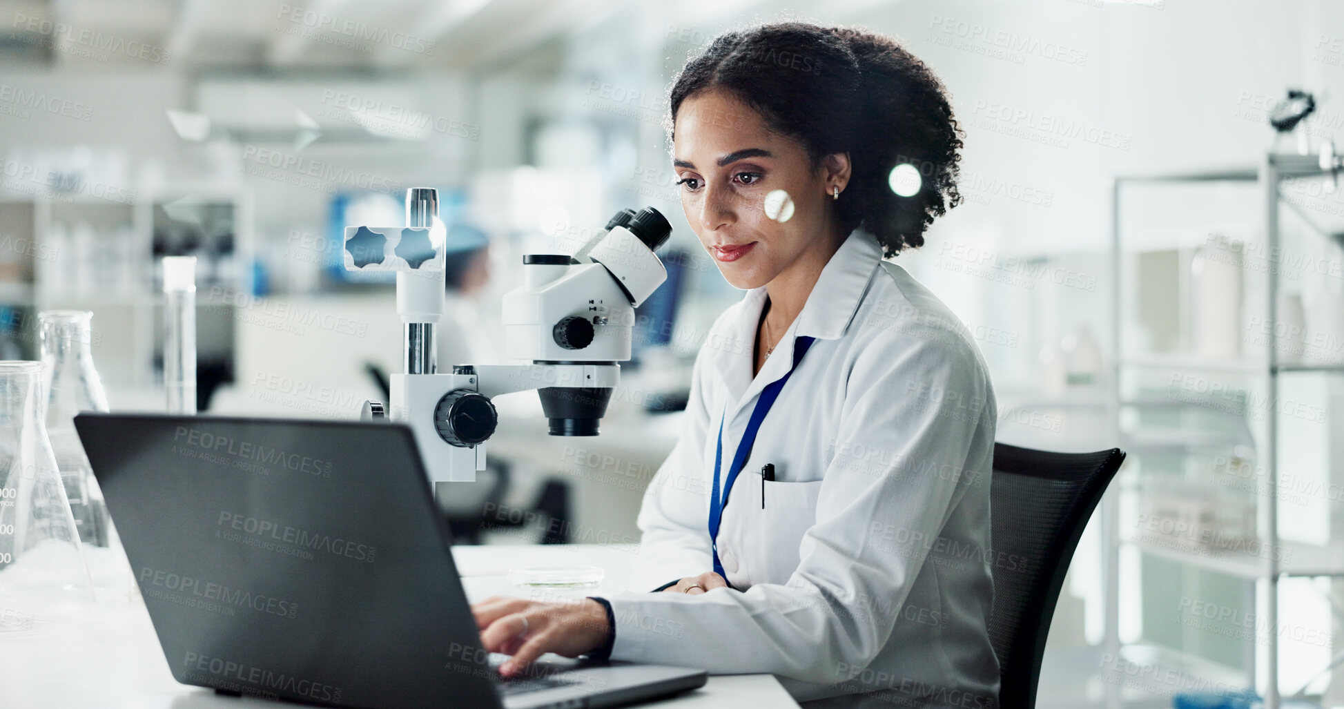 Buy stock photo Research, laptop and woman in lab, microscope and testing with science experiment, biotech and medicine. Results, researcher and employee with equipment, pc or study with sample analysis or medical