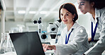 Happy woman, scientist and coaching intern with laptop for research, discovery or breakthrough at lab. Female person training junior biologist on computer in medical study, exam or test at laboratory