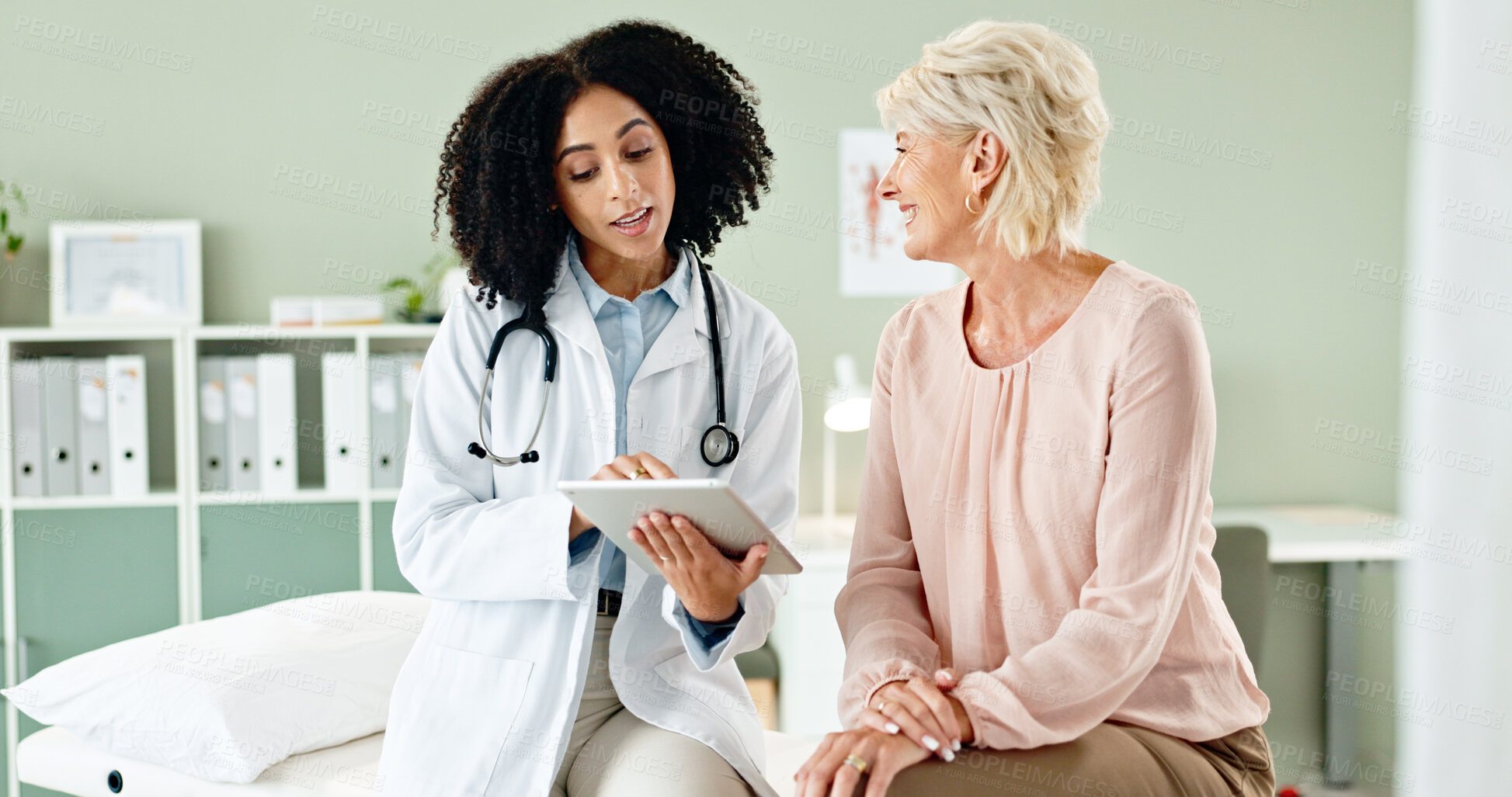 Buy stock photo Woman, doctor and consulting patient with tablet in checkup for medical results, diagnosis or prescription at hospital. Female person talking to client for consultation, help or advice at clinic