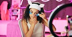 Woman, content creator and ring light for recording, cosmetics influencer and live streaming in studio. Smartphone, beauty and tutorial for eye mask on social media, vlogger person for online webcam