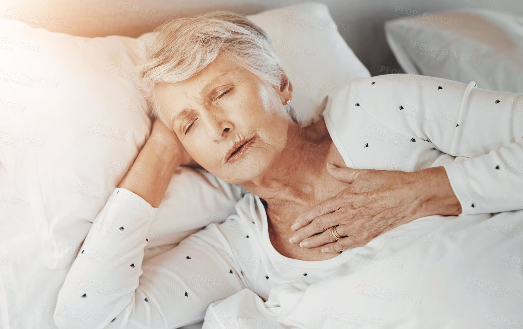 Buy stock photo Bed, sick and senior woman with chest pain, heart attack or medical emergency at nursing home. Healthcare, stroke and elderly female person with breathing, lung or cardiac arrest at assisted living.