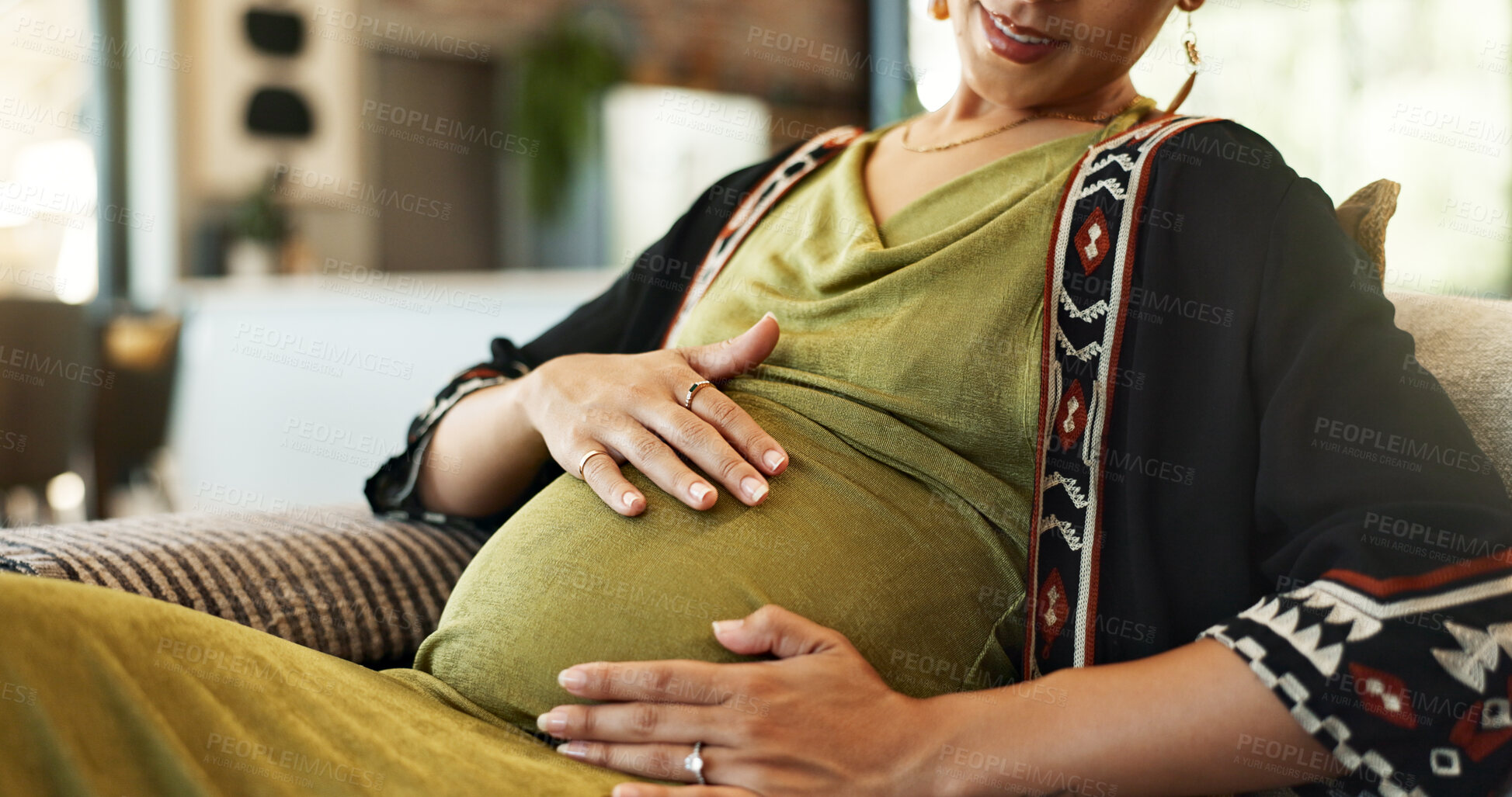 Buy stock photo Pregnant, stomach and hands of woman on sofa for wellness, maternity health and resting in home. Pregnancy, parenting and person touch tummy for comfort, love and care for motherhood in living room