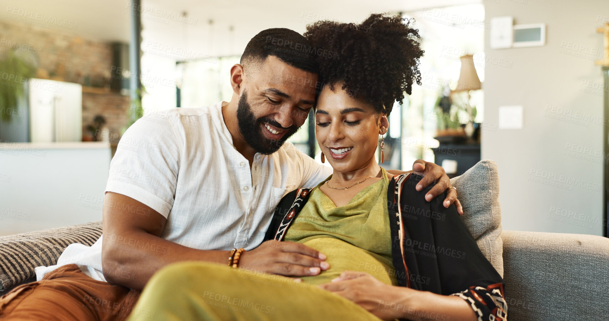 Buy stock photo Love, pregnancy and happy couple on sofa with hands on stomach for support, care and bonding at home together. Maternity, future or people in living room with belly growth, hug and child development