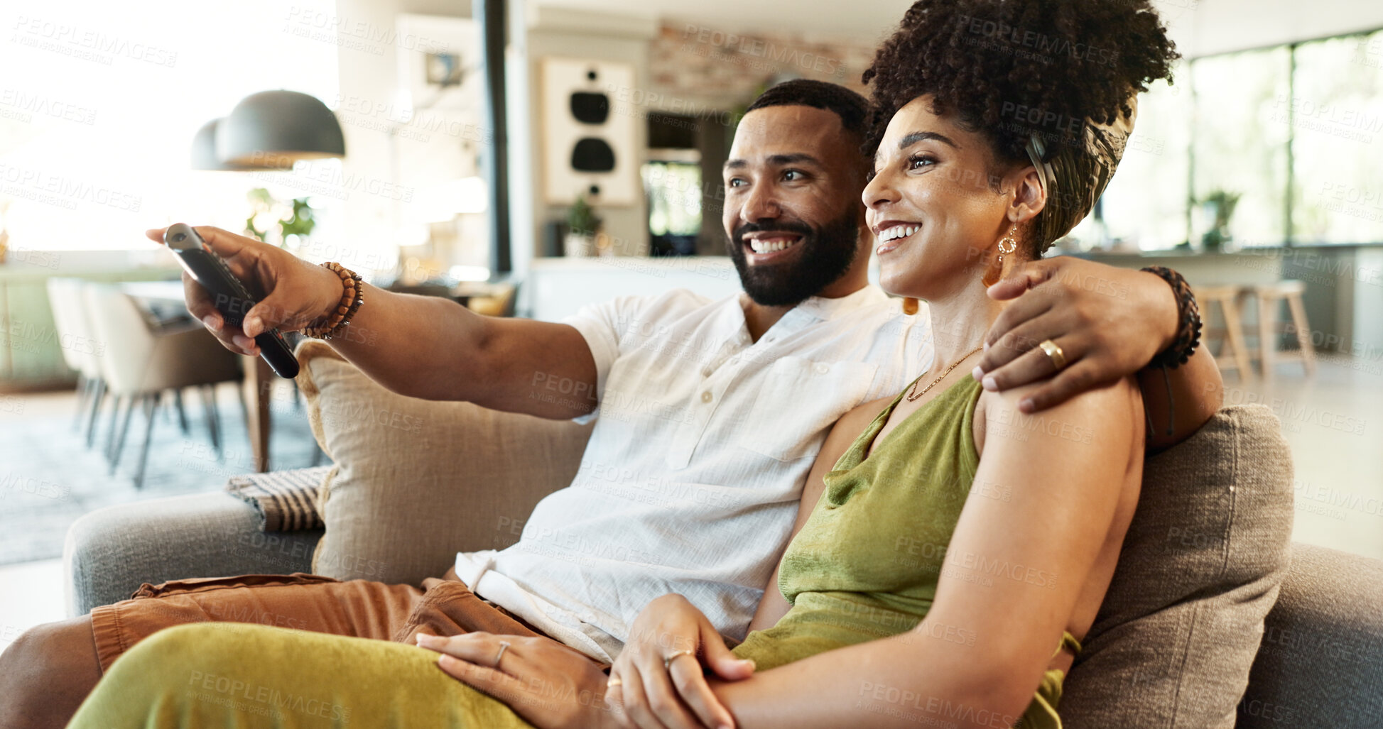 Buy stock photo Love, hug and couple watching tv on a sofa with remote control for movie, choice or film search at home bonding. Relax, television and people embrace in a living room with cable service entertainment