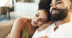 Love, happy and couple on sofa relax for bonding, loving relationship and enjoy weekend together. Marriage, home and man and woman embrace on couch for affection, romance and smile in living room