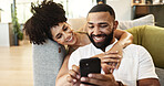 Couple, phone and couch with social media, hug and smile together in home with app. Online shopping, streaming and happy people with technology and mobile video with web meme on the internet