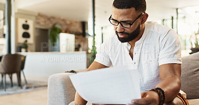 Buy stock photo Man, paperwork and finance with budget in home for mortgage loan, investment planning or bills. Person, research and glasses with banking documents on sofa with invoice for expenses, savings or taxes