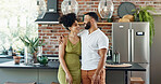 Kitchen, love and couple hug in home for bonding, loving relationship and commitment together. Weekend, marriage and man and woman embrace for affection, romance and happy for new house or apartment