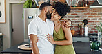 Kitchen, love and happy couple hug in home for bonding, loving relationship or commitment together. Dating, marriage and man and woman embrace for affection, romance or love in new house or apartment