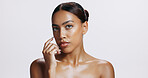 Beauty, shine and portrait of woman, serious and treatment of skincare, soft and glow of body in studio. Pink background, face and proud for skin, dermatology and cosmetics for person and hand