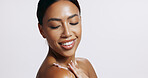 Black woman, beauty and skin glow with thinking from body care, dermatology and wellness in studio. Cosmetics, facial and smile from skincare and natural treatment with white background and mockup