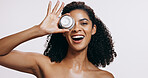 Black woman, skincare and portrait with cream, cosmetics and sunscreen product with smile from beauty. White background, facial and skin glow with eco friendly and anti aging face lotion in studio