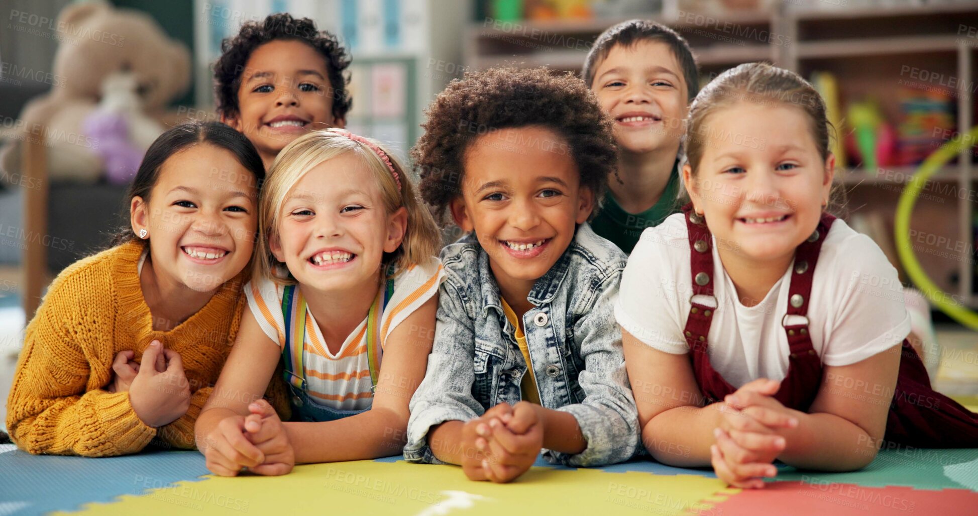 Buy stock photo Kindergarten, kids and face with smile on floor for education, knowledge and learning at academy. Students, friends and happy with diversity in school for child development, scholarship and bonding