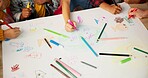 Children, friends and hands drawing for creative project or school academy for art class, learning or lesson. Pencils, colouring and paper or teamwork with childhood development, classroom or craft