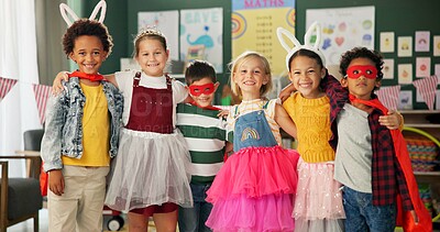 Buy stock photo Happy kids, friends and hug with costume in class for dress up or casual day at school together. Portrait of young group with smile for halloween in cosplay outfit, hero or fairy tale in classroom