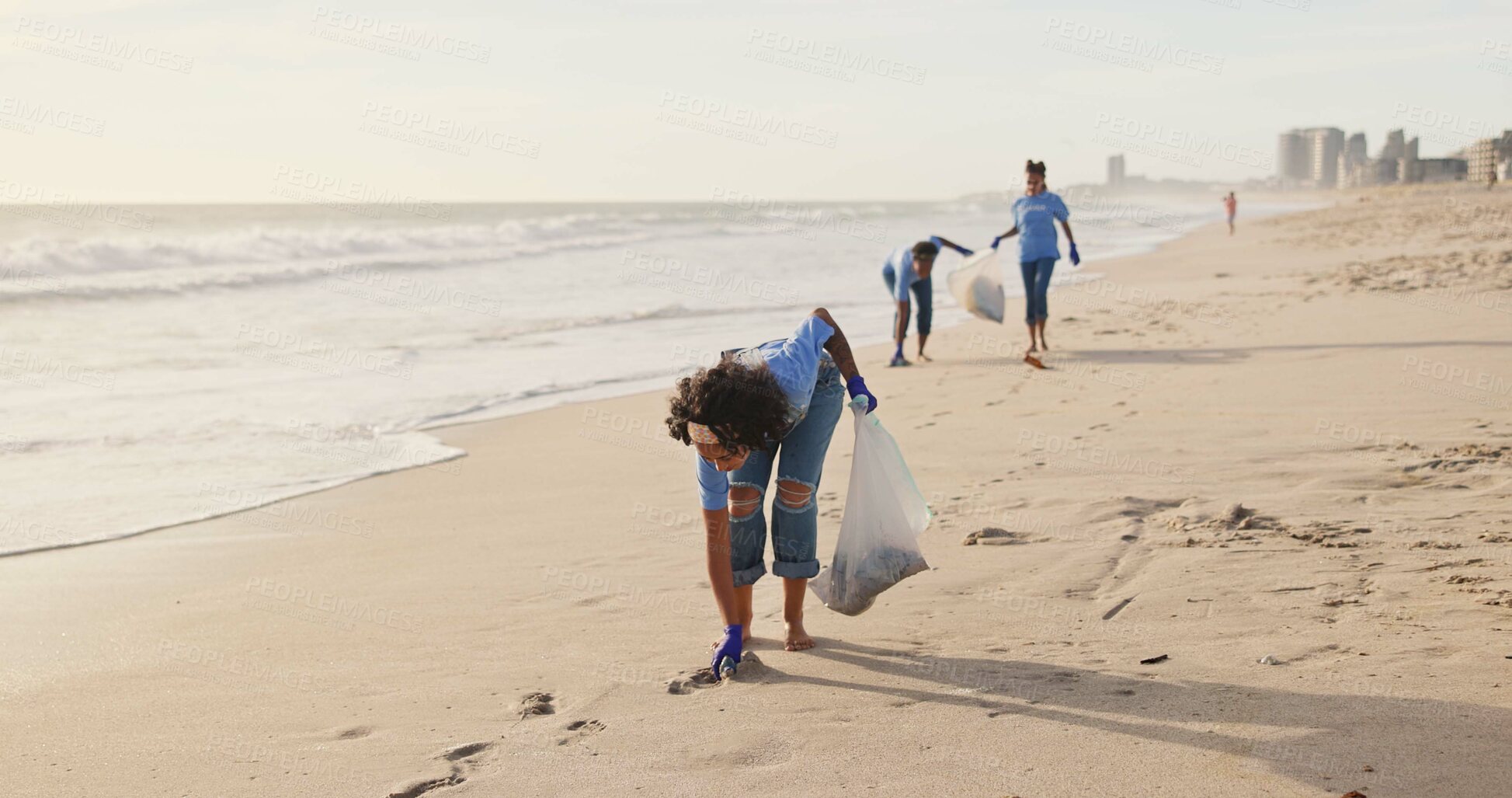 Buy stock photo Volunteer, beach or people with plastic bag in nature for sustainability, help or ocean cleaning project. Accountability, team or volunteer at sea for earth day, social responsibility or NGO charity