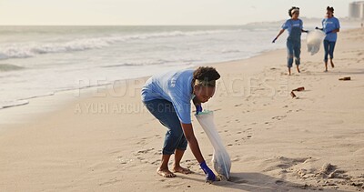 Buy stock photo Volunteer, beach and trash cleaning with teamwork for community service or pollution, plastic or waste management. Women, climate change and nature ocean for recycling, global warming or environment