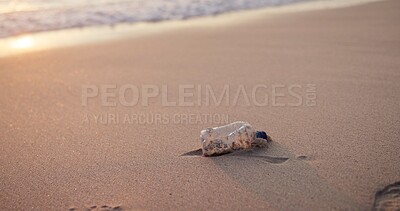 Buy stock photo Beach, plastic bottle and pollution in environment for recycling volunteering, climate change or waste management. Garbage, ocean and community service for global litter, earth day or sustainability