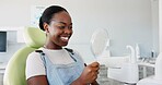 Happy, black woman and dental teeth with mirror for clean mouth, oral or gum care at dentist. Young African female person with big smile for tooth whitening, hygiene or healthcare with reflection