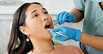 Asian woman, dentist and patient with clinic tools for cleaning mouth, oral or gum in dental care. Face of female person in relax with orthodontist for tooth whitening, hygiene or removing cavity