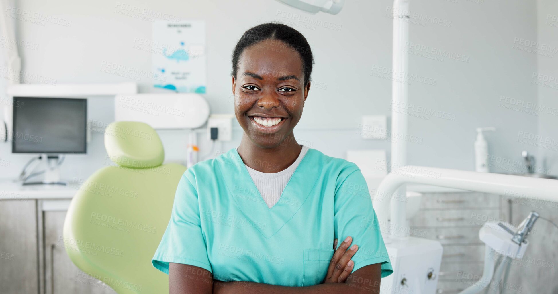 Buy stock photo Face, dentist and arms crossed with black woman in scrubs at hospital for dental care or oral hygiene. Portrait, smile for healthcare and happy young orthodontist professional at clinic for dentistry