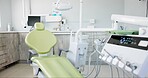 Empty dentist room, chair and equipment for cleaning, wellness and oral health with tools in clinic. Hospital, dental and mouth care by furniture, machine or interior for teeth, surgery or consulting