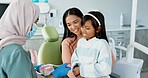 Child, dentist or education of brushing teeth in office or family friendly demonstration of tooth hygiene. Girl, parent or pediatric orthodontist with dental model to brush or lesson on mouth care