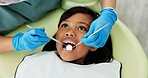 Child, pediatric dentist and checkup of teeth in chair and family friendly examination for tooth health. Girl, dental mirror and consultation by orthodontist with trust and examination for mouth care