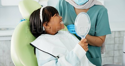 Buy stock photo Dentist, woman and kid with mirror for dental health, results and teeth cleaning service with medical advice or support. Orthodontist or doctor talking to child or excited girl of tooth procedure