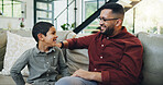 Smile, bonding and child with dad on sofa relaxing together for fathers day celebration at home. Happy, love and boy kid talking to man for care and family time on couch in living room at house.