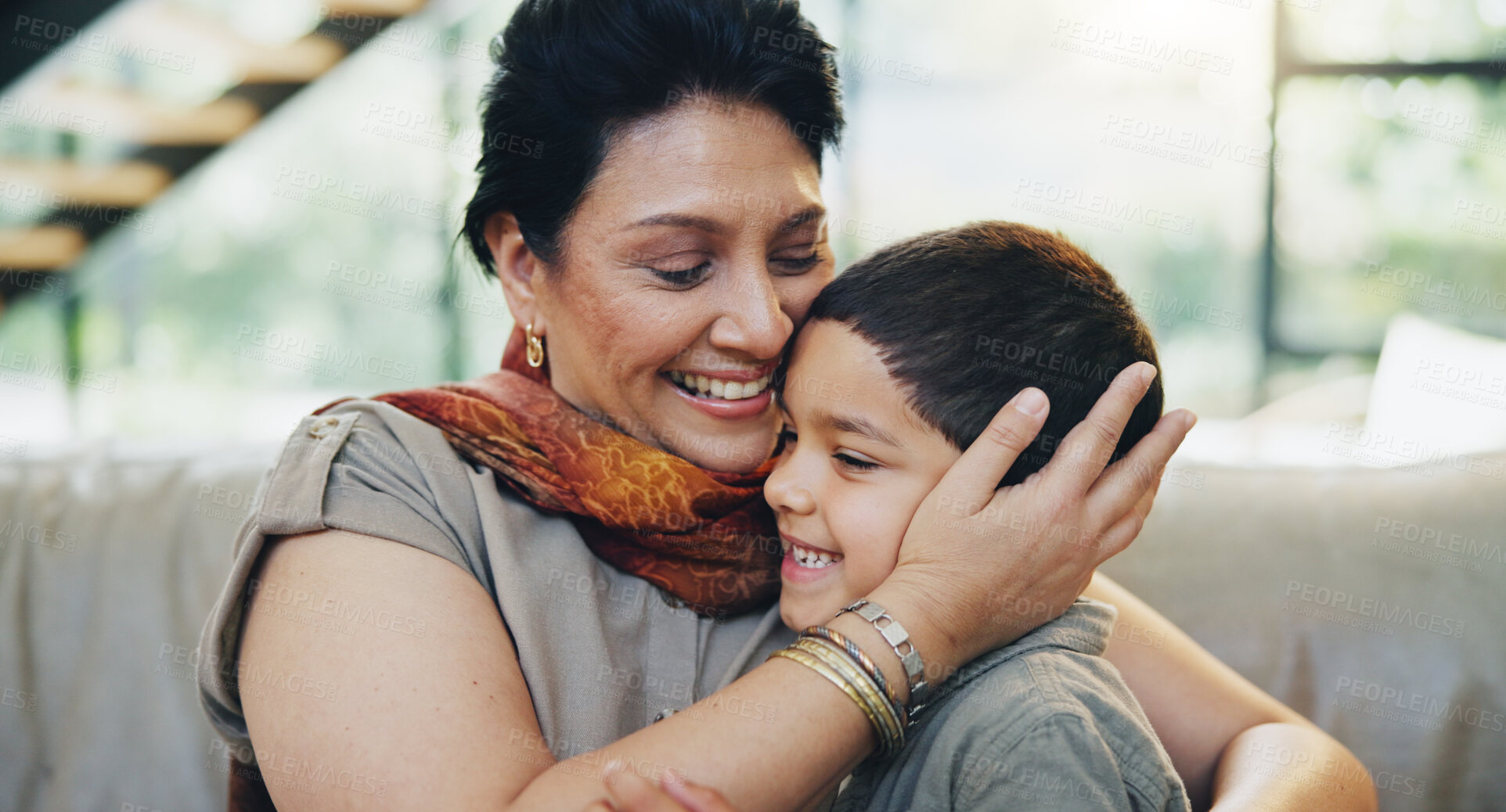 Buy stock photo Smile, child and hug grandmother on sofa at house for bonding, love and relax with care on weekend break. Happy, mature woman and boy gratitude embrace, family support and security together in lounge