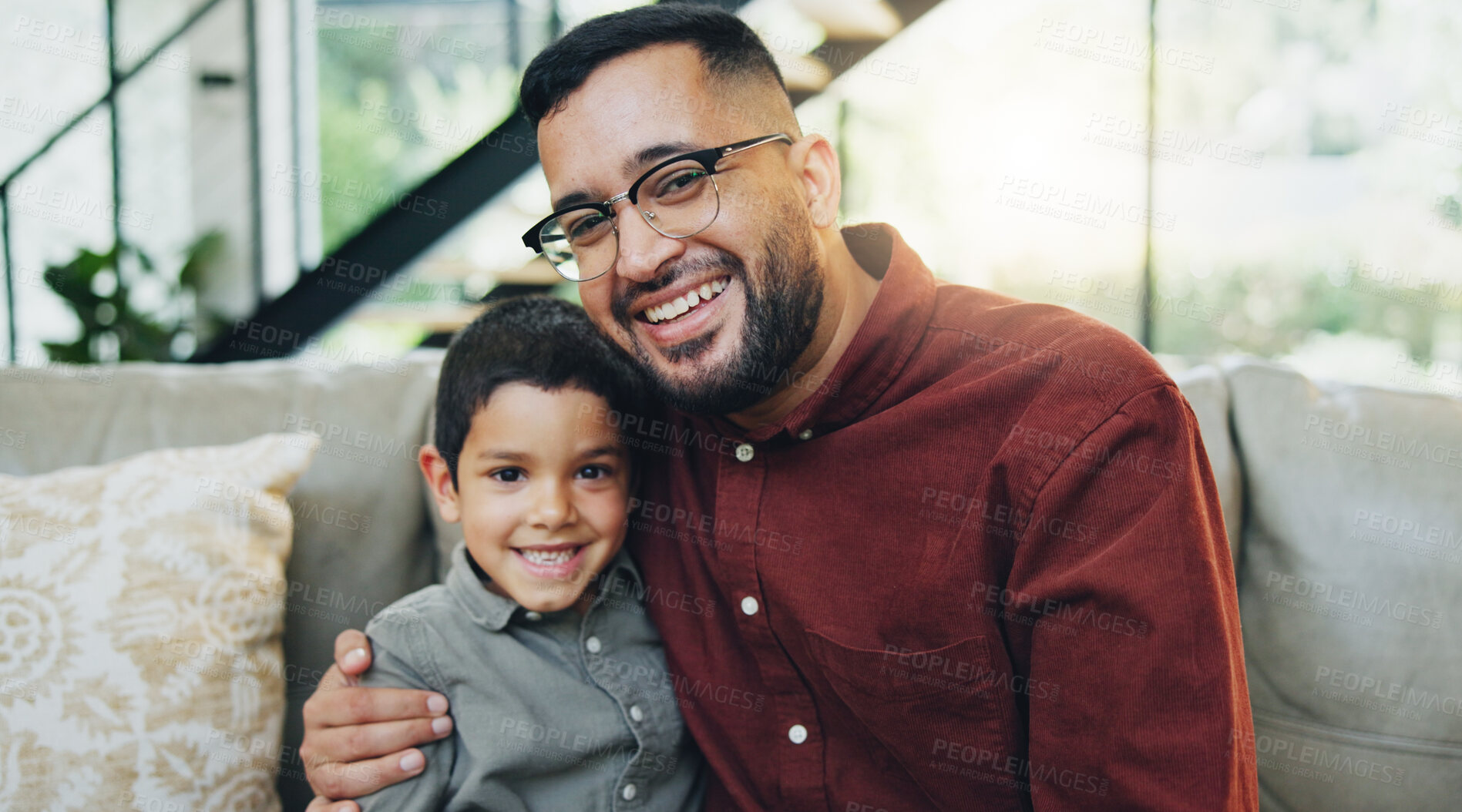 Buy stock photo Smile, hug and portrait of child with dad on sofa relaxing together for fathers day celebration. Happy, love and boy kid embracing with man for care, bonding and family time in living room at home.