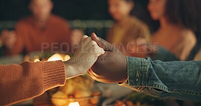 Buy stock photo Closeup, holding hands and praying, food and friends worship together, gratitude and thanks to God at dinner party. Men, women with nutrition and religion, celebration and social event at night