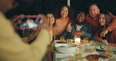 Buy stock photo Friends, photography and outdoor dinner with phone, patio or happy for new years eve celebration on blog. Women, men and group with sign, icon and hug with smartphone screen for post on social media