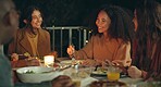 Friends, night and dinner at party, patio and happy for conversation, food and new years eve celebration. Women, man and group at table with chat, memory and comic laugh for joke, diversity and event