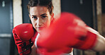 Woman, portrait and gloves for training as athlete in fitness center for challenge in sports or wellness. Female person, workout and strong with health, pride for performance in mma, boxing or fight