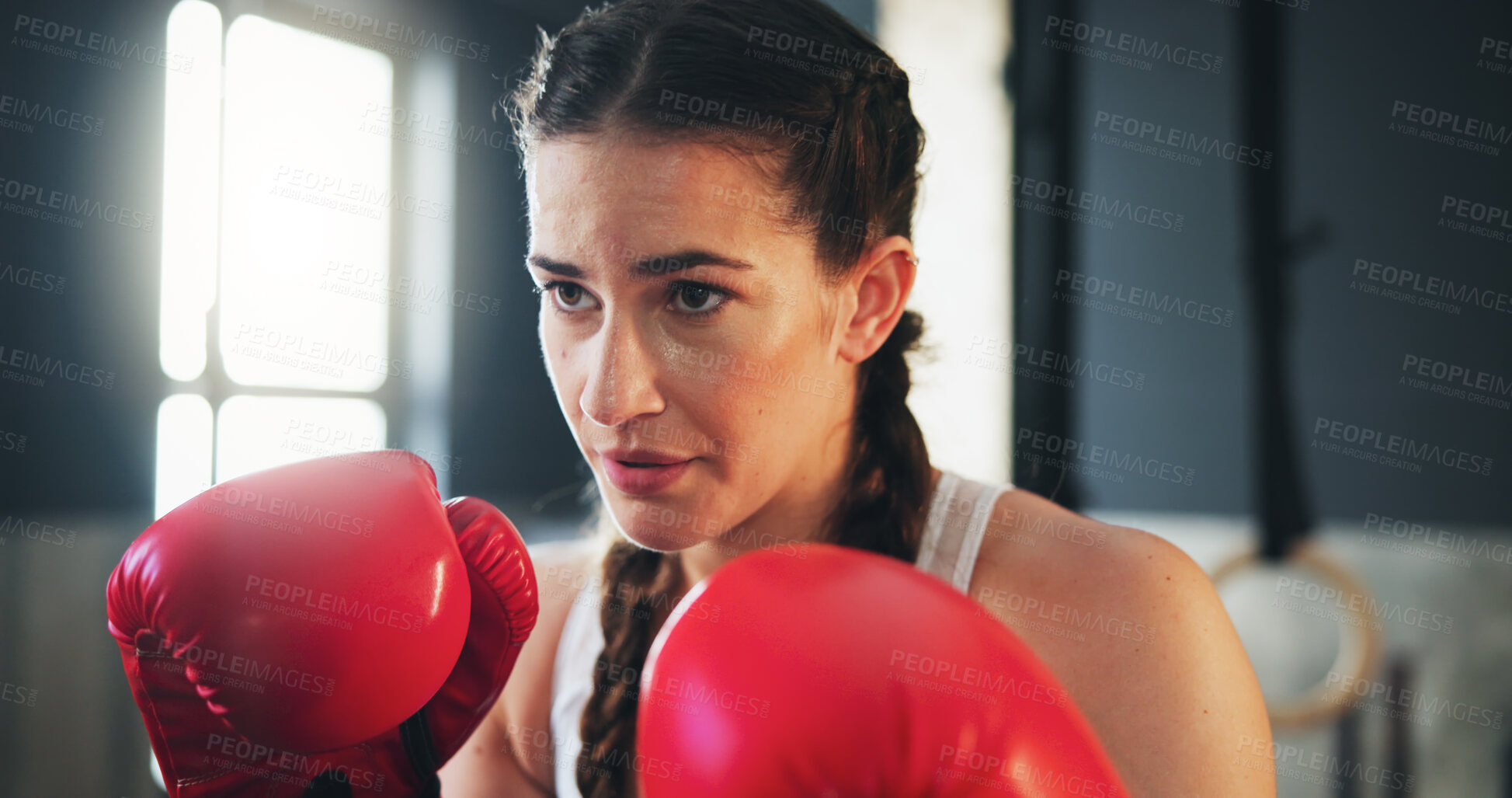 Buy stock photo Boxing, woman and fitness in gym for training, self defense and exercise for development. Gloves, power workout and female athlete with equipment for sport, growth and fighting with hard work