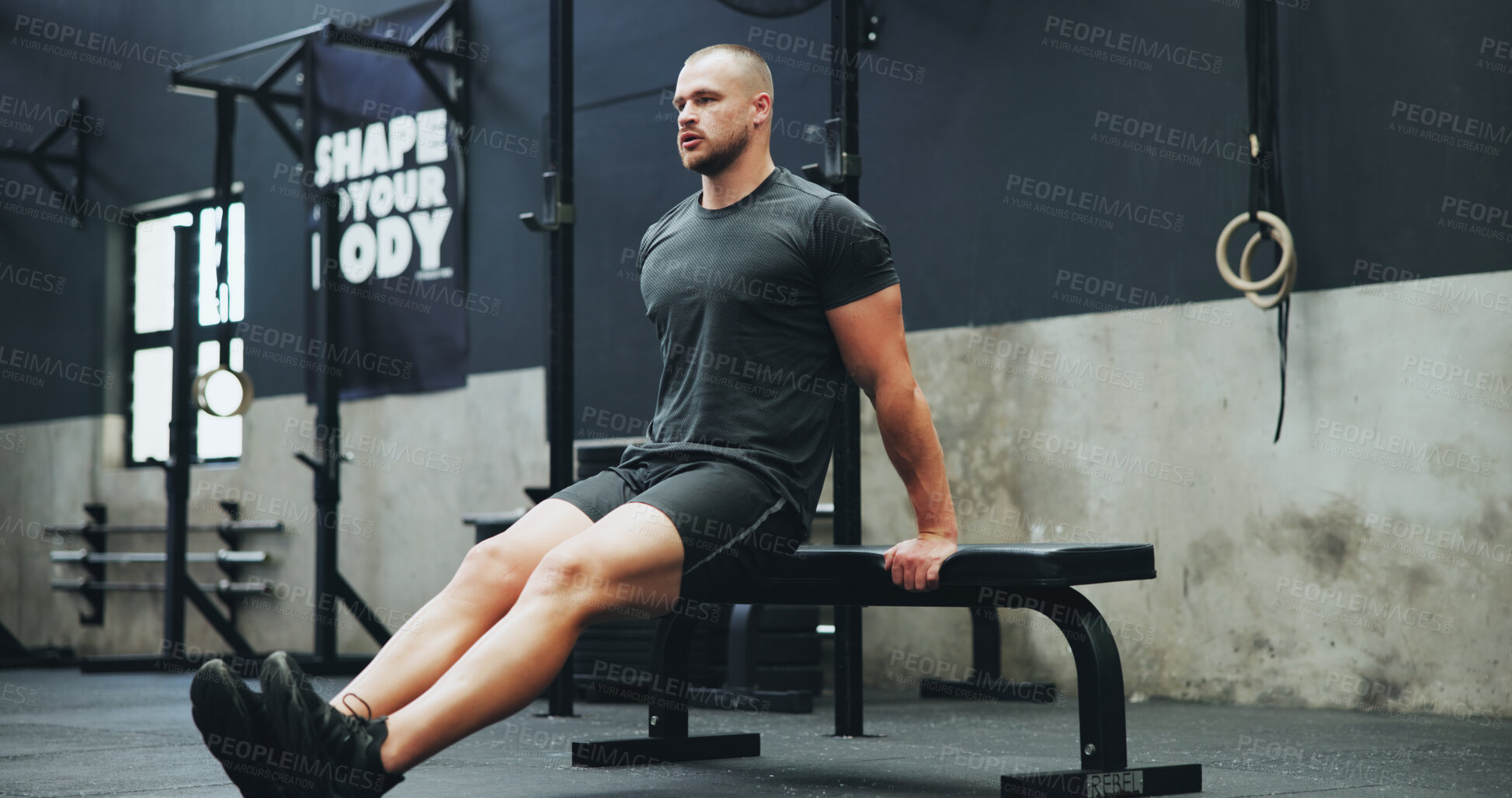 Buy stock photo Gym, bench and man with dips workout for body building, strength and muscle training. Fitness, athlete and strong male person with exercise with equipment for triceps or arms in sports studio.