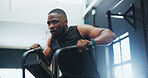 Sports, gym and man on stepping machine for health, muscle and body workout or training. Fitness, active and African male athlete with cardio exercise on equipment for endurance in wellness studio.