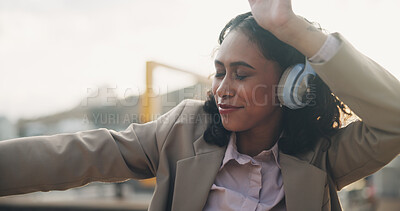 Buy stock photo Happy person, headphones and dancing in city with music on app for online streaming in outdoor for celebration. Career woman, technology and cheerful for promotion, achievement or success in England