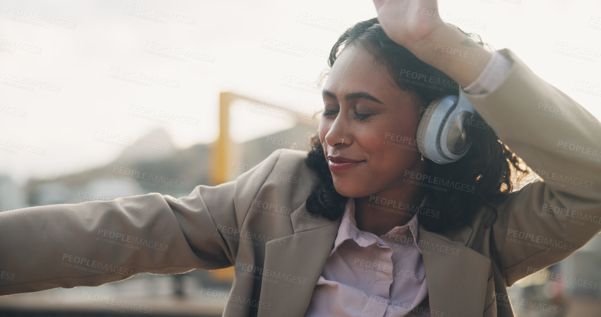 Buy stock photo Happy person, headphones and dancing in city with music on app for online streaming in outdoor for celebration. Career woman, technology and cheerful for promotion, achievement or success in England