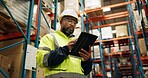 Warehouse, black man and manufacturing with tablet, inventory and checklist in a factory. African person, worker and employee with tech and inspection with digital app for logistics and online stock