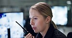 Talking, security and woman with radio, cctv and monitor to watch, danger and control room for guard. Desk, night and working for protection, safety and communication to backup and connection