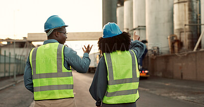 Buy stock photo Construction worker, team and discussion with walking at logistics site in morning for inspection and architecture. Shipping industry, collaboration and outdoor with meeting for project management