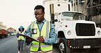 Industrial, outdoor and black man with clipboard in shipping for inspection, inventory check or delivery schedule. Logistics, checklist and employee for distribution, supply chain or quality control