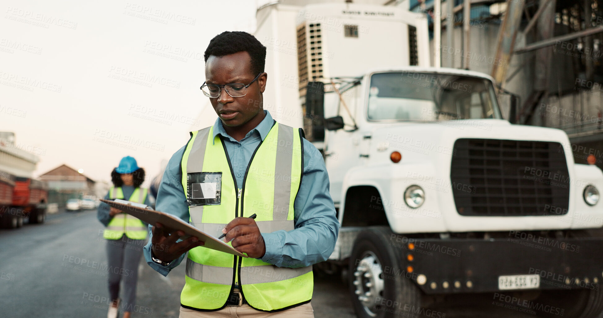 Buy stock photo Industrial, outdoor and black man with clipboard in shipping for inspection, inventory check or delivery schedule. Logistics, checklist and employee for distribution, supply chain or quality control