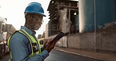 Buy stock photo Construction, planning and black man on tablet in city for inspection, building and maintenance. Civil engineering, architecture and person on tech for project, infrastructure and manufacturing