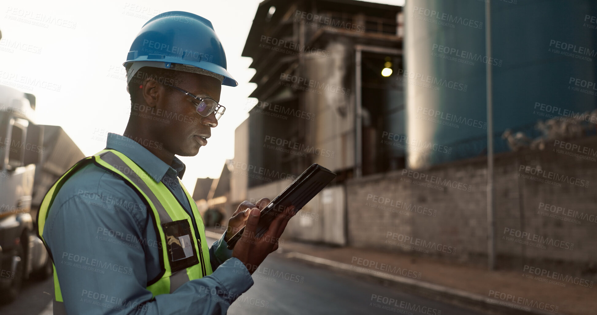 Buy stock photo Construction, planning and black man on tablet in city for inspection, building and maintenance. Civil engineering, architecture and person on tech for project, infrastructure and manufacturing