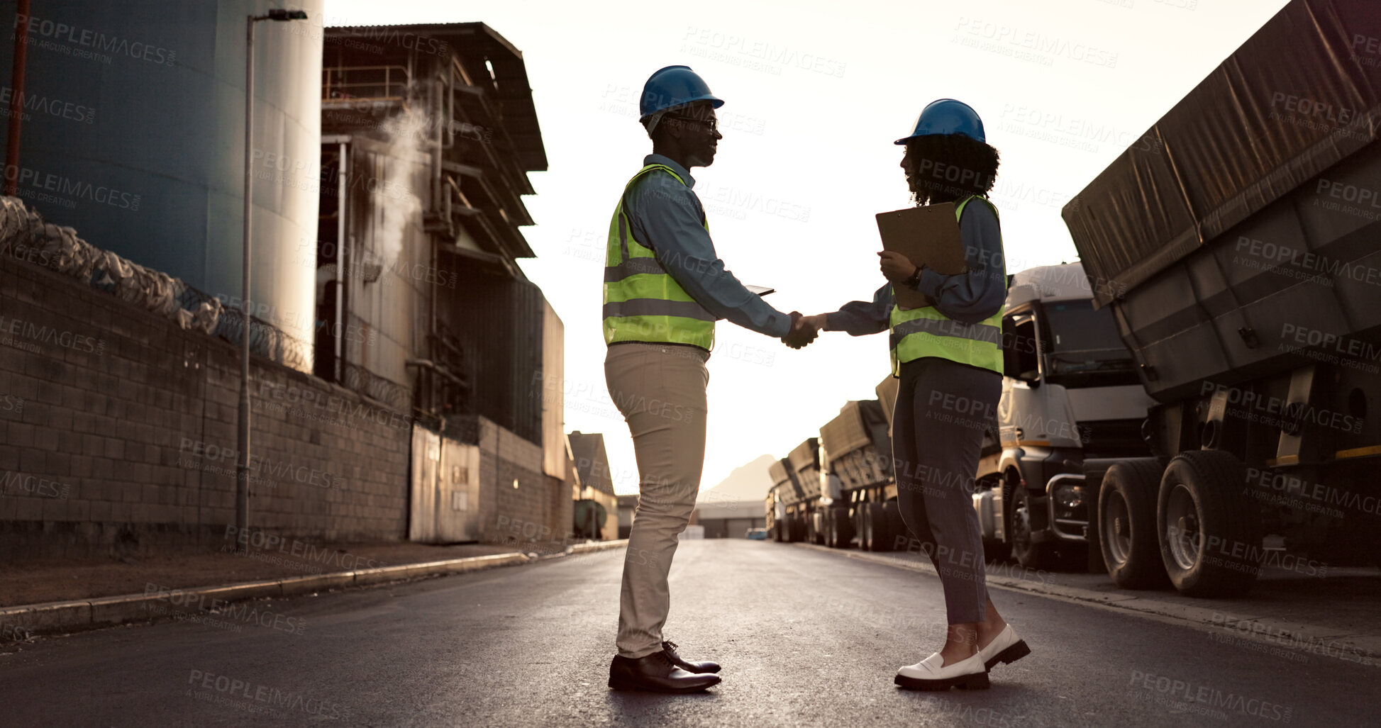 Buy stock photo Engineer, handshake and people at construction site for welcome, greeting or agreement on building plan. B2B, contractor man and black woman with clipboard for deal, partnership and collaboration