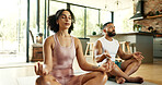 Calm, home and couple with meditation on floor for mental health, balance or mindfulness on weekend. Zen, man and woman with spiritual healing exercise for chakra, awareness or connection in marriage